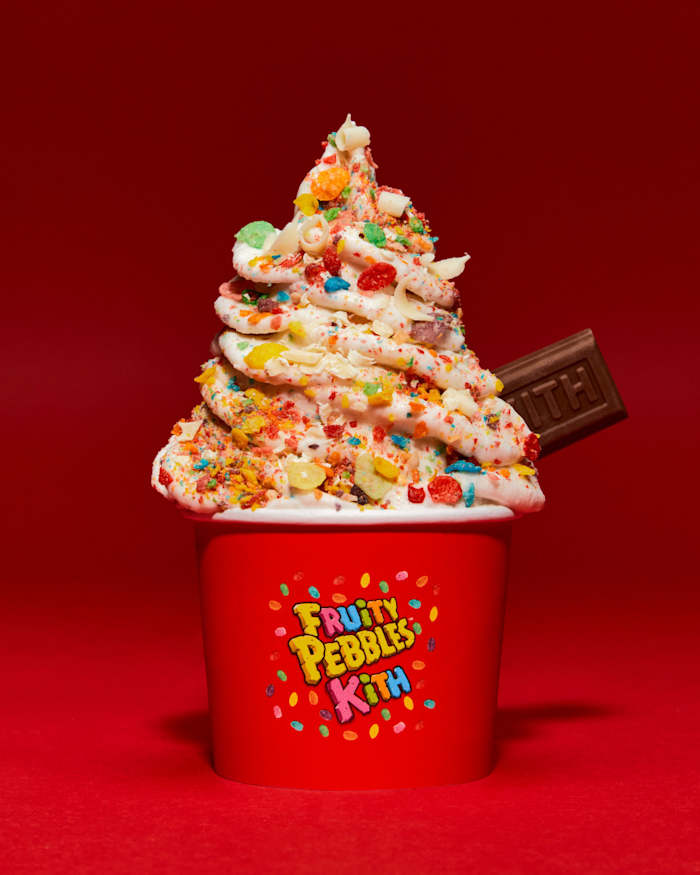 Ice cream topped with Fruity Pebbles cereal.